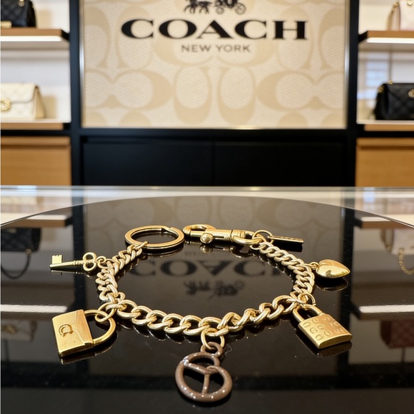 Coach Gold Tone Charm Bracelet with Padlock and KeyCharms